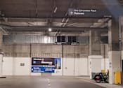 Thumbnail 9 of 10 - A parking garage with a sign that says "Convention Place Parking.".