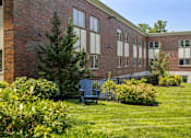 Thumbnail 3 of 33 - Lush, Green Outdoor Space with a Chair at 735 Truman, Hyde Park, Massachusetts