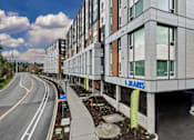 Thumbnail 35 of 38 - A modern building with the sign "LSJARIS" on the side.