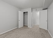 Thumbnail 41 of 51 - A room with a carpeted floor and three doors.