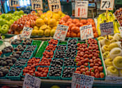 Thumbnail 50 of 51 - A fruit stand with a variety of fruits on display.