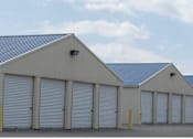 Thumbnail 4 of 10 - A series of garage doors are closed.