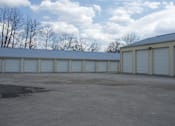Thumbnail 2 of 10 - A row of garage doors are closed.