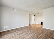 Thumbnail 18 of 30 - A room with wooden flooring and white walls  at Grand  Valley Apartments, Milford, Ohio