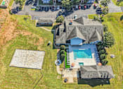 Thumbnail 3 of 33 - A large house with a pool and a trampoline.