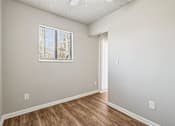 Thumbnail 14 of 30 - A room with a window and wooden flooring at Grand  Valley Apartments, Milford, OH