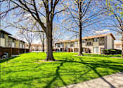 Thumbnail 22 of 31 - Courtyard With Mature Trees at Black Hawk Apartments, Fort Wayne, IN, Indiana