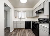 Thumbnail 2 of 31 - Efficient Appliances In Kitchen at Black Hawk Apartments, Fort Wayne, IN
