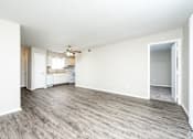 Thumbnail 6 of 31 - Expansive Living Room with vinyl flooring at Black Hawk Apartments, Fort Wayne