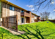 Thumbnail 11 of 31 - Patio and a privacy fence at Black Hawk Apartments, Fort Wayne, IN, Indiana