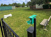 Thumbnail 14 of 31 - Clean dog park with a bench with fence at Black Hawk Apartments, Fort Wayne, IN, 46815