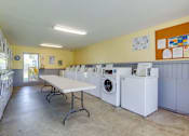 Thumbnail 20 of 31 - Laundromat with washing machines at Black Hawk Apartments, Fort Wayne, IN, 46815