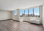 Thumbnail 10 of 22 - Irvine Park Towers apartment living room with expansive windows and views of St. Paul
