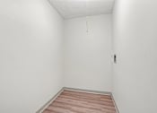Thumbnail 22 of 22 - Irvine Park Towers apartment storage or utility space with wood-look flooring
