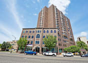 Thumbnail 3 of 22 - Exterior view of Irvine Park Towers apartment building from West 7th Street
