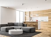 Thumbnail 7 of 7 - A grey sofa set in a modern living room with a round coffee table in the middle.