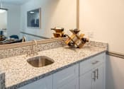 Thumbnail 4 of 23 - A kitchen counter with a sink at Paces Ridge at Vinings, Atlanta, GA, 30339