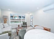 Thumbnail 9 of 37 - Living Room and Dining Area at Woodland Place Apartments, Langford, British Columbia