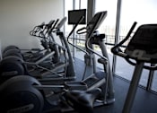 Thumbnail 22 of 29 - A row of treadmills in a gym.at 66 Main, Yonkers, NY 10701