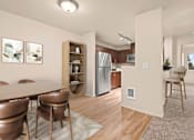 Thumbnail 8 of 18 - A kitchen with a refrigerator, dining table and chairs.
