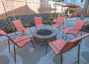 Thumbnail 4 of 18 - A patio with a fire pit and chairs. at Mill Creek Meadows Apartments, Mill Creek, WA, 98012