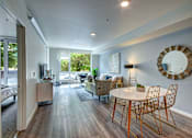 Thumbnail 24 of 43 - A modern living room with a white table and chairs. at Ravello Apartments, Redmond, WA, 98052