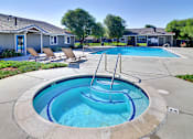 Thumbnail 10 of 30 - A small pool with a fountain in the middle of it.