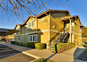 Thumbnail 2 of 41 - A two-story house with a staircase leading to the second floor.