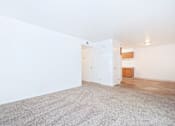 Thumbnail 15 of 30 - A room with a white wall and a carpeted floor.
