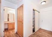 Thumbnail 30 of 35 - A white room with a wooden floor and a white door.