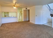 Thumbnail 17 of 17 - A room with a carpeted floor and a ceiling fan.