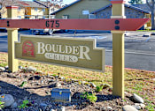 Thumbnail 1 of 17 - A sign for Boulder Creek with a red and white striped top.