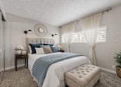 Thumbnail 16 of 25 - A bedroom with a bed, nightstand, and window. at Infinity on the Landing Apartments , Apartments, Euless, TX