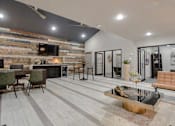 Thumbnail 14 of 25 - A modern living room with a wooden wall. at Infinity on the Landing Apartments, Euless, Texas