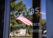 Thumbnail 74 of 74 - A window with a reflection of a flag and the word 