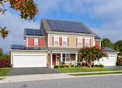 Thumbnail 29 of 37 - A house with solar panels on the roof.