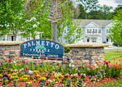 Thumbnail 45 of 74 - A sign that says Palmetto Terrace Neighborhood Center in front of a house.
