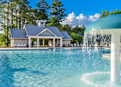 Thumbnail 11 of 74 - A house with a pool and a waterfall.