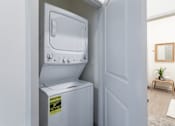 Thumbnail 36 of 69 - A white oven with a sticker on it is in a room.