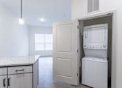 Thumbnail 35 of 69 - A white oven is built into a cabinet in a kitchen.