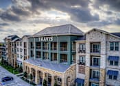 Thumbnail 26 of 36 - A large building with the word "TRAVIS" on it.