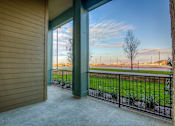 Thumbnail 15 of 36 - A view from a house looking out to a field.