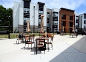 Thumbnail 24 of 27 - Patio with furniture at The Landing Apartments, Avon, Indiana