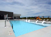 Thumbnail 23 of 27 - Swimming pool with chairs at The Landing Apartments, Avon, Indiana
