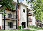 Thumbnail 8 of 70 - Apartment building with balconies and trees in front. at The Pointe, LaVista, 68128