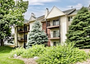 Thumbnail 6 of 70 - Apartment buildings with balconies and greenery in front. at The Pointe, LaVista, Nebraska