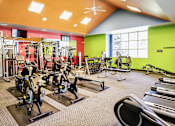 Thumbnail 36 of 70 - A gym with a variety of exercise equipment including treadmills, stationary bikes, and weight machines. at The Pointe, Nebraska, 68128