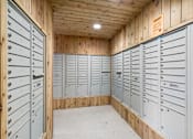 Thumbnail 30 of 36 - A room with wooden walls and ceiling and a long row of metal lockers.