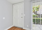 Thumbnail 63 of 133 - A white door is in a room with a white wall.