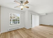 Thumbnail 80 of 133 - A room with a ceiling fan and a window with blinds.